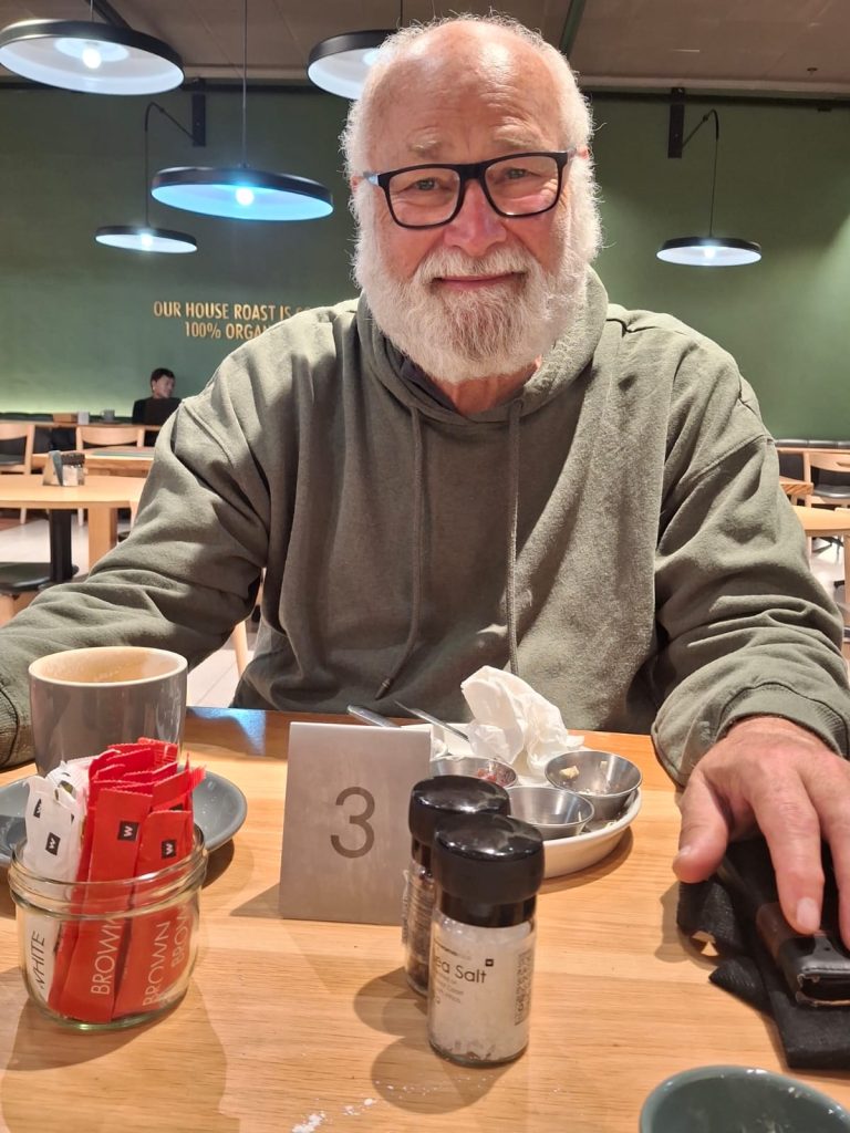 Jean smiling at a cafe after his oncologis appointment - relief and hope 29th July 2026