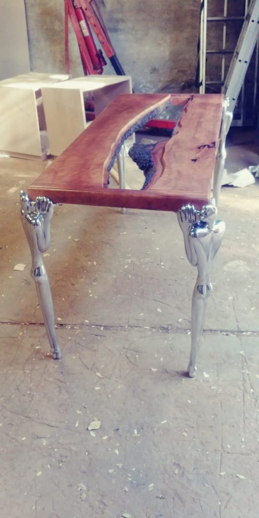Bespoke timber and glass table being assembled in the workshop.