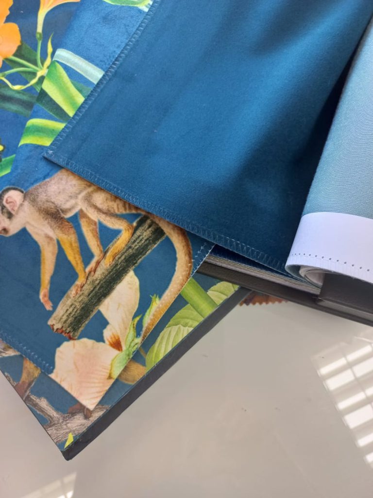 Botanical fabric with butterflies, flowers, monkeys and vibrant plain blue velvet
