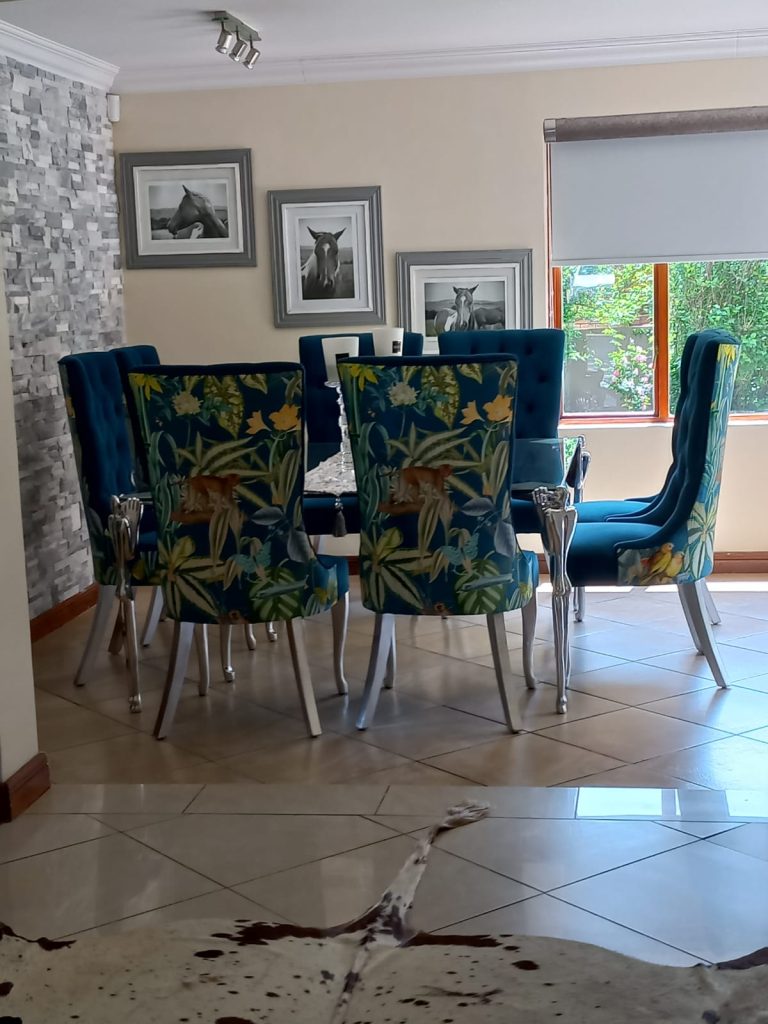 Dining Room with three framed horse photographs on the wall