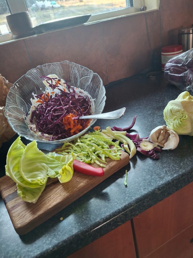 Homemade coleslaw with red and green cabbage, grated carrot and fresh ingredients
